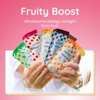 Hands holding Lecka energy gels with colorful packaging on a pink background, labeled 'Fruity Boost'.
