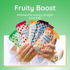 Hands holding Lecka energy gels with colorful packaging against a green background, featuring the text 'Fruity Boost' and 'Wholesome energy, straight from fruit.'.