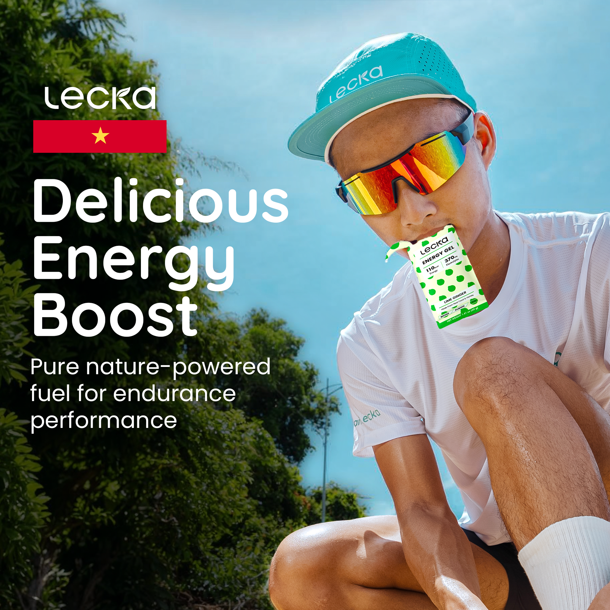 Person wearing sunglasses and a cap, sitting outdoors with Lecka energy boost packaging.
