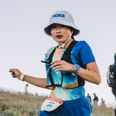 Trail runner fueling with Lecka bar mid-run